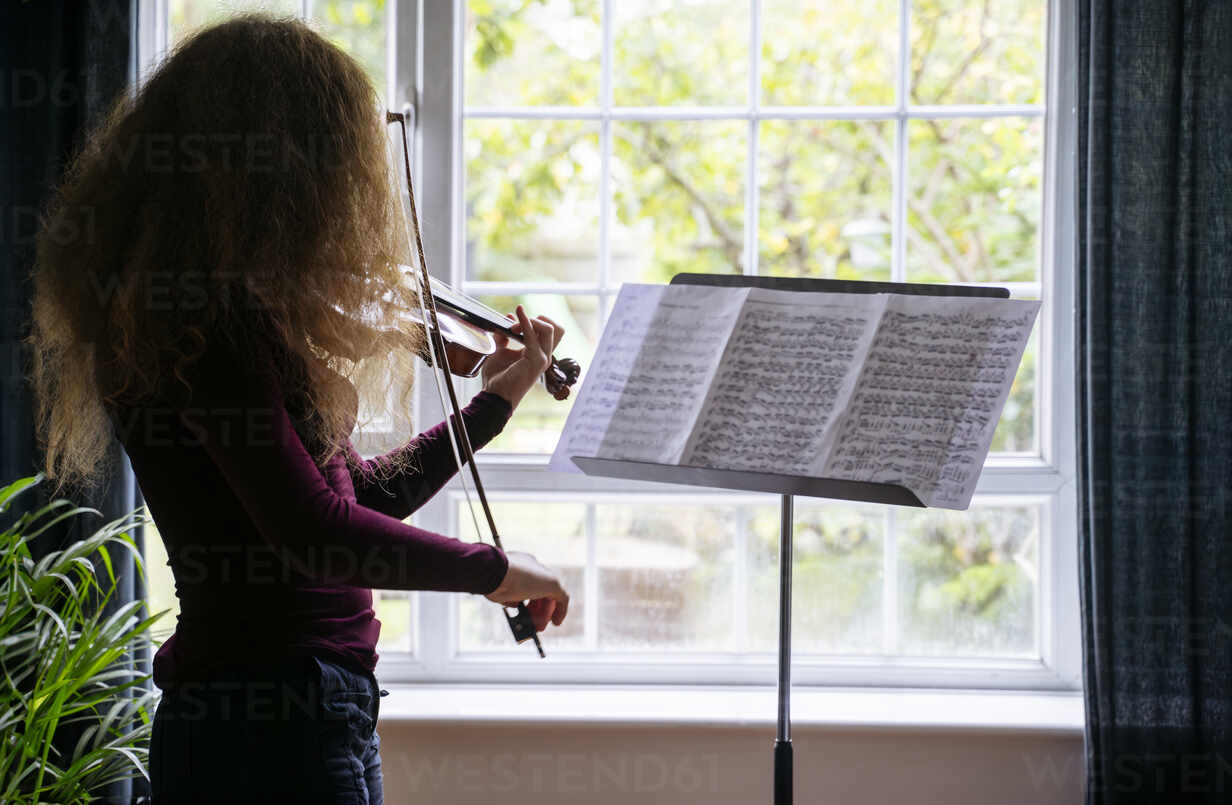 A woman playing the violin